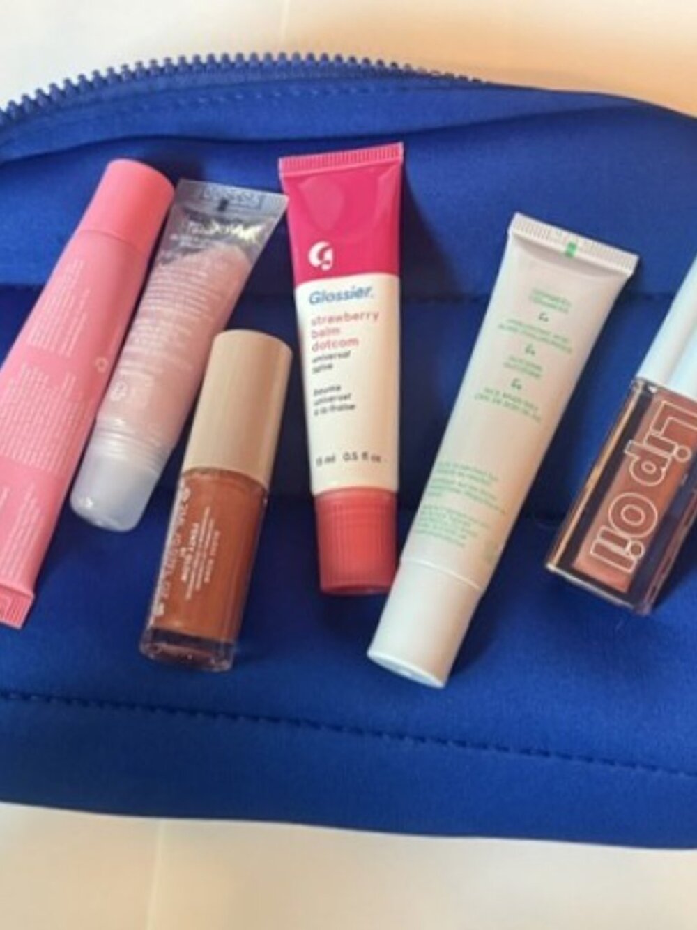 6 lip balms and glosses Glossier Ultra Violette Juicy Tubes Fenty Sephora bag